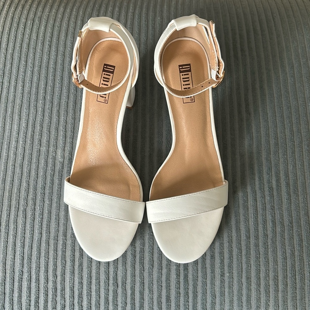 Dressy white shoes with 3 inch heels. Women’s size 6.5
